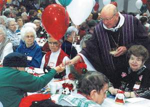 photo of Bishop Bullock distributing Communion at Apostolate to the Handicapped Mass