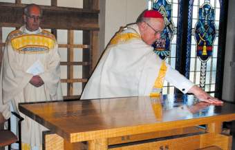 photo of Bishop Bullock anointing altar at Catholic Multicultural Center chapel