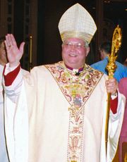 photo of Bishop Morlino waving as he leaves St. Raphael Cathedral