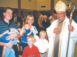 photo of Bishop Morlino with Hetzel family