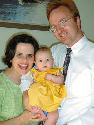 photo of new mother Melanie Pfeil with her husband, Scott, and daughter, Maria