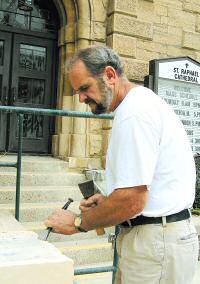 photo of Jacob Arndt restoring stones at St. Raphael Cathedral in Madison