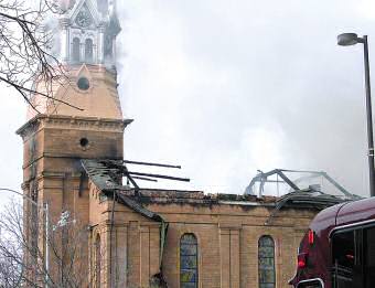 photo of smoke rising from St. Raphael Cathedral in downtown Madison March 14