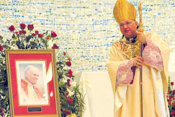 photo of Bishop Morlino giving homily at memorial Mass for Pope John Paul II in Monona