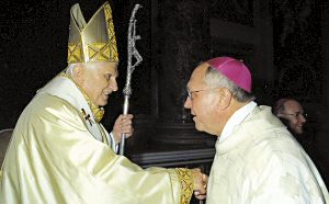 photo of Pope Benedict XVI and Bishop Robert C. Morlino greeting one another at St. Peter's Basilica in Rome