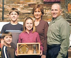 photo of the Cindy and Paul Lawinger family receiving the Traveling Chalice at St. Joseph Parish in Dodgeville