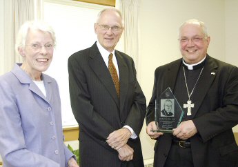 photo of Barbara and Robert Ozburn of Janesville presenting Bishop Robert C. Morlino with the Cardinal Von Galen Award for his 'strong pro-life actions'