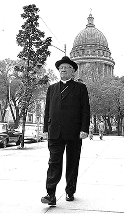 Bishop William P. O’Connor walking in downtown Madison