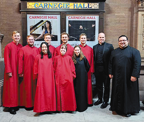 The St. Maria Goretti Parish choir stands with Pastor Fr. Scott Emerson and Choir Director Marco Melendez outside of Carnegie Hall. (Contributed photo)