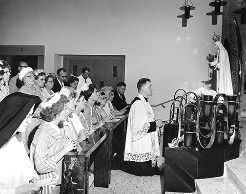 Parishioners pray to Our Lady of the Green Scapular at Immaculate Heart of Mary Church in Monona in the 1960s. (Contributed photo)